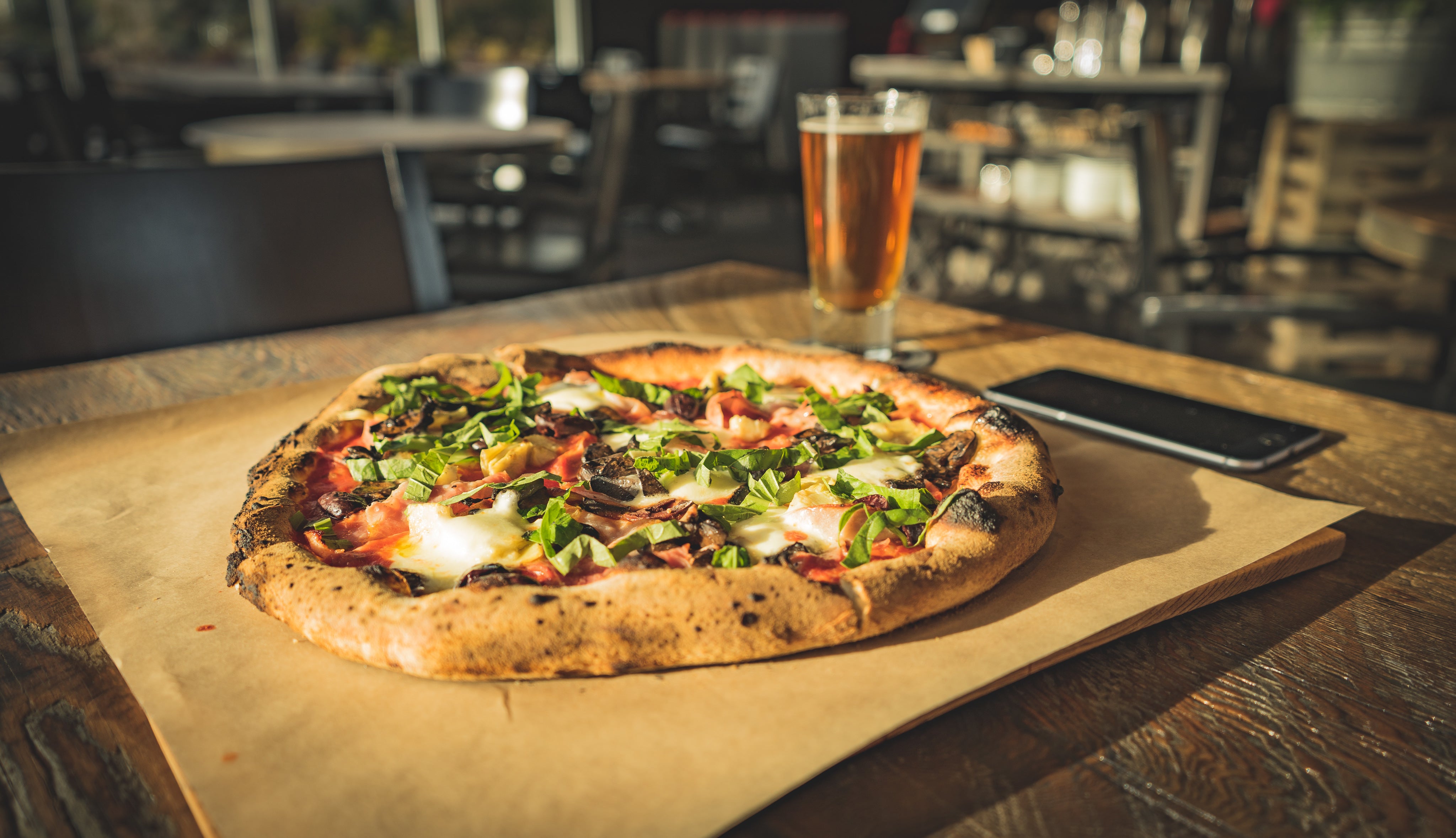dinner-for-one-of-wood-fired-pizza-paired-with-cold-beer.jpg