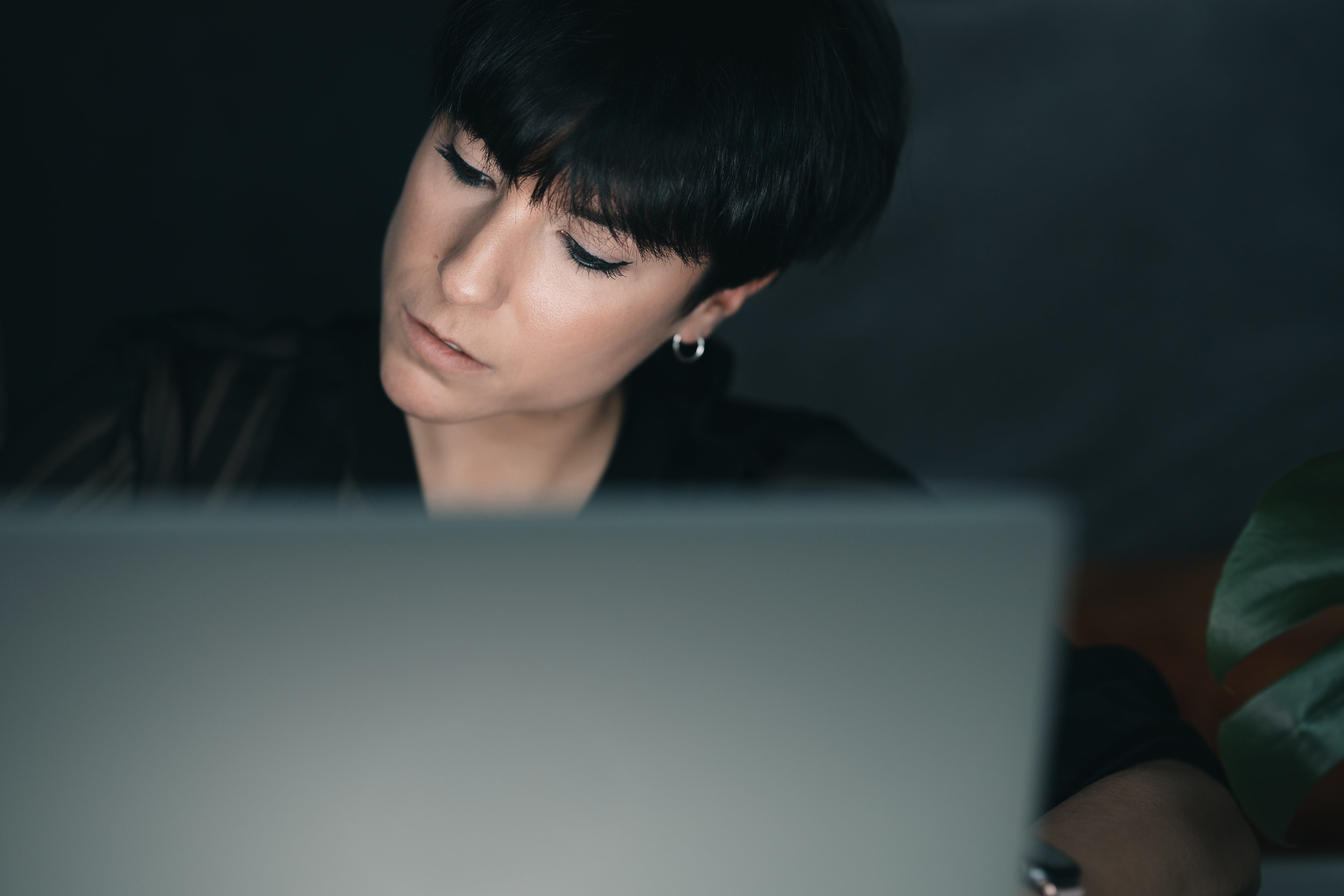 woman-concentrates-while-sitting-behind-a-laptop.jpg